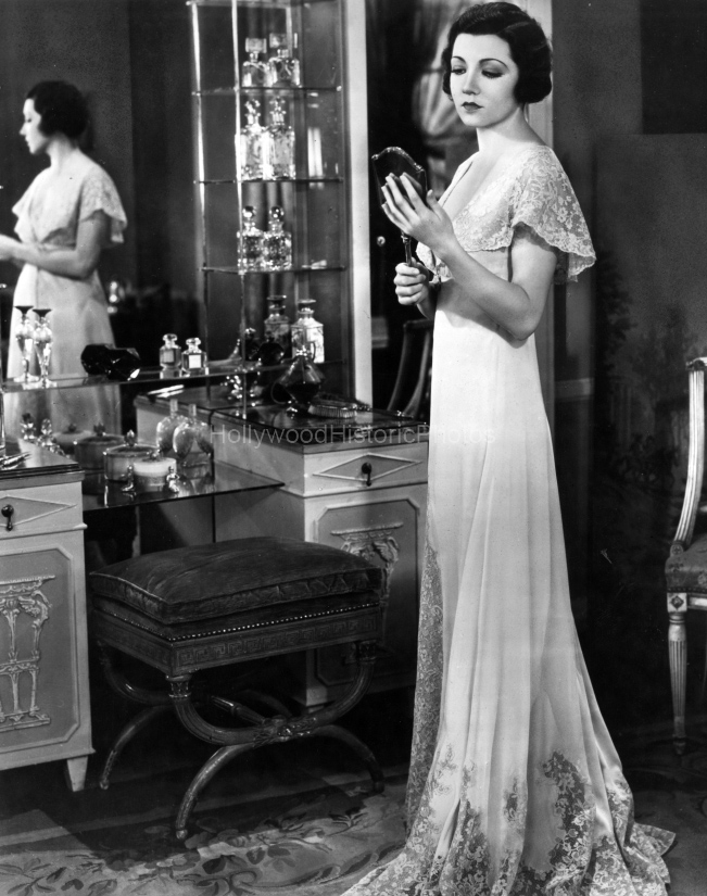 1930 gazing into mirror.jpg